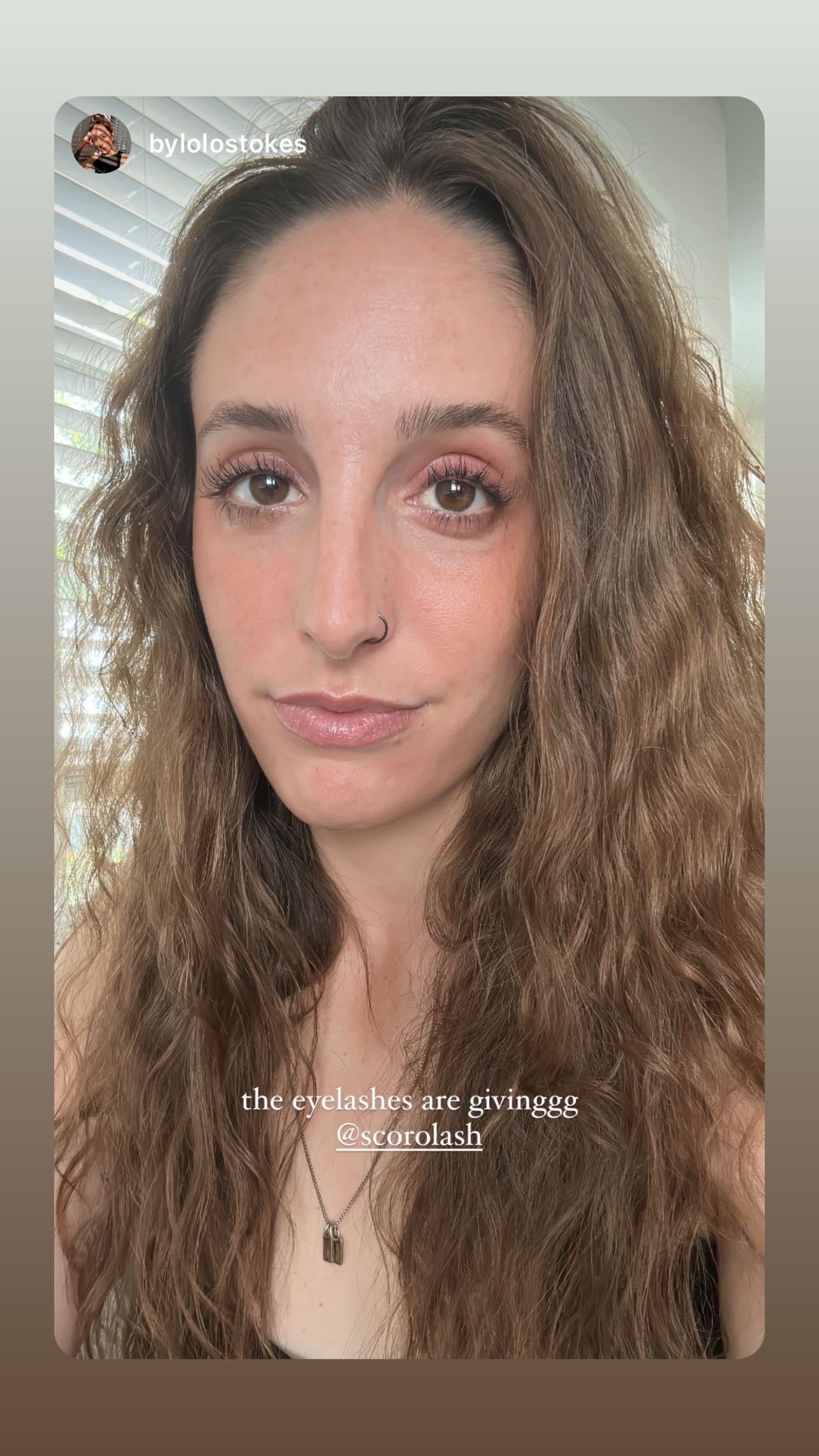 A selfie picture showcasing our beautiful customer's results using our Scorolash Eyelash Volumizing Growth Serum and her experience using our products